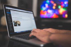 Blogger typing on the laptop