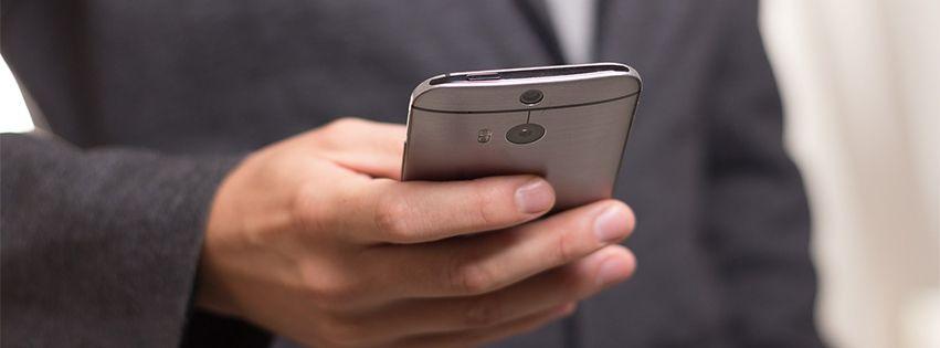 man looking at his cellphone